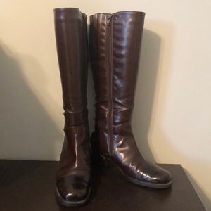 Brown and black riding boots